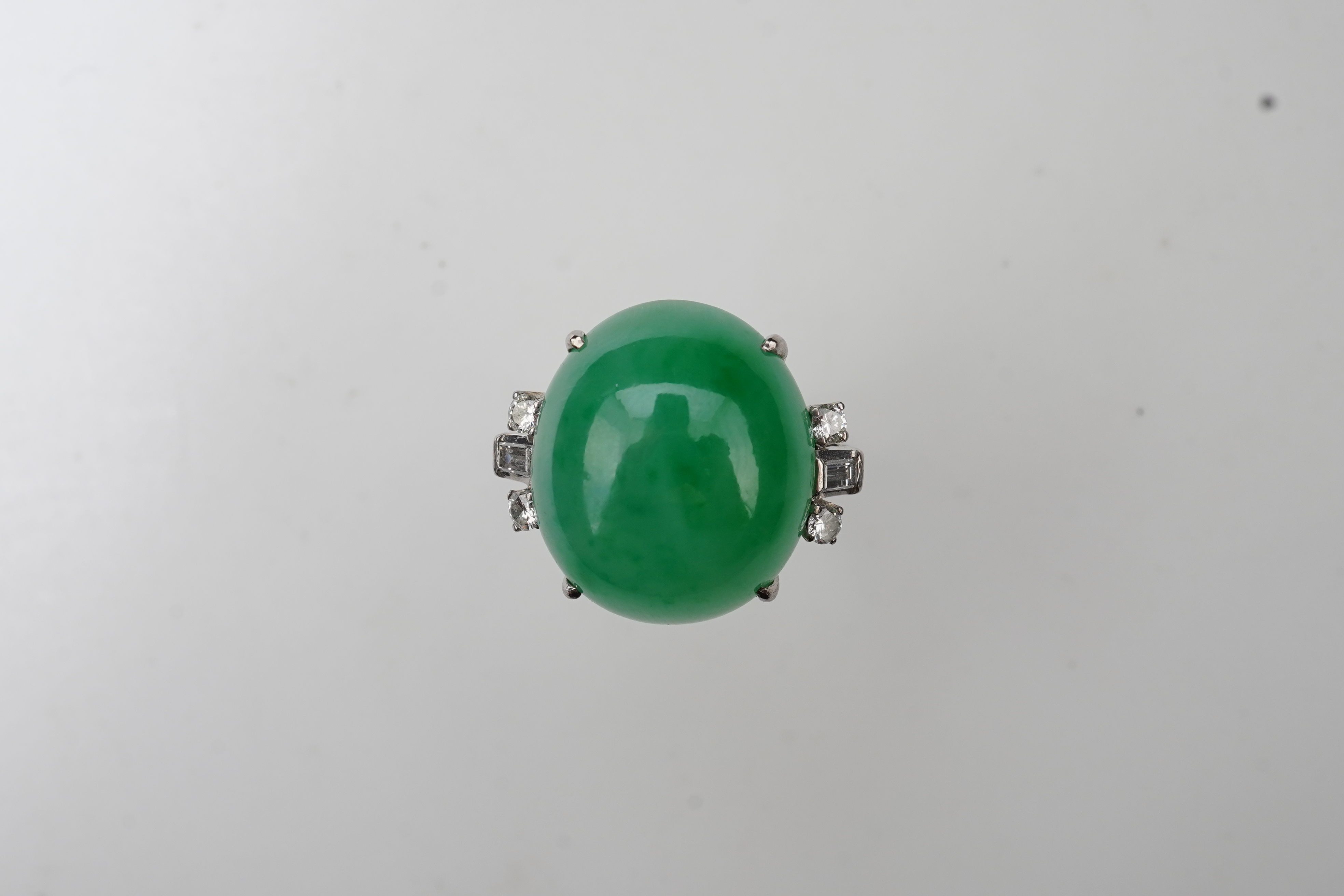 A jadeite and diamond ring